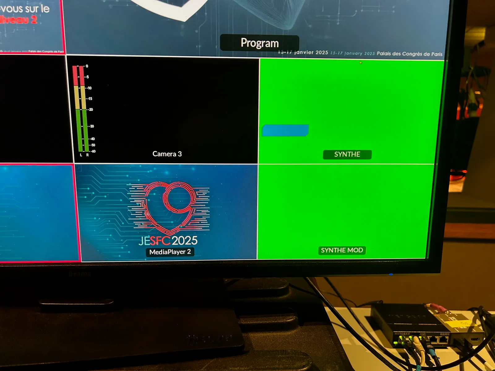 Photo of a screen showing an accurate CGI rendering on a green background