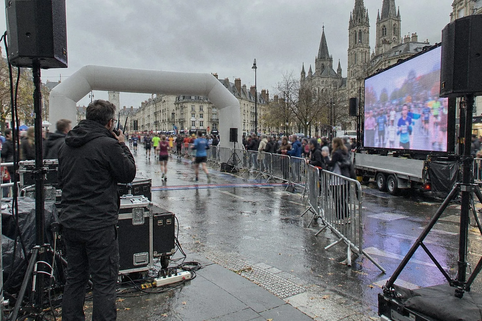 Finish area of a city race with a giant screen and sound system