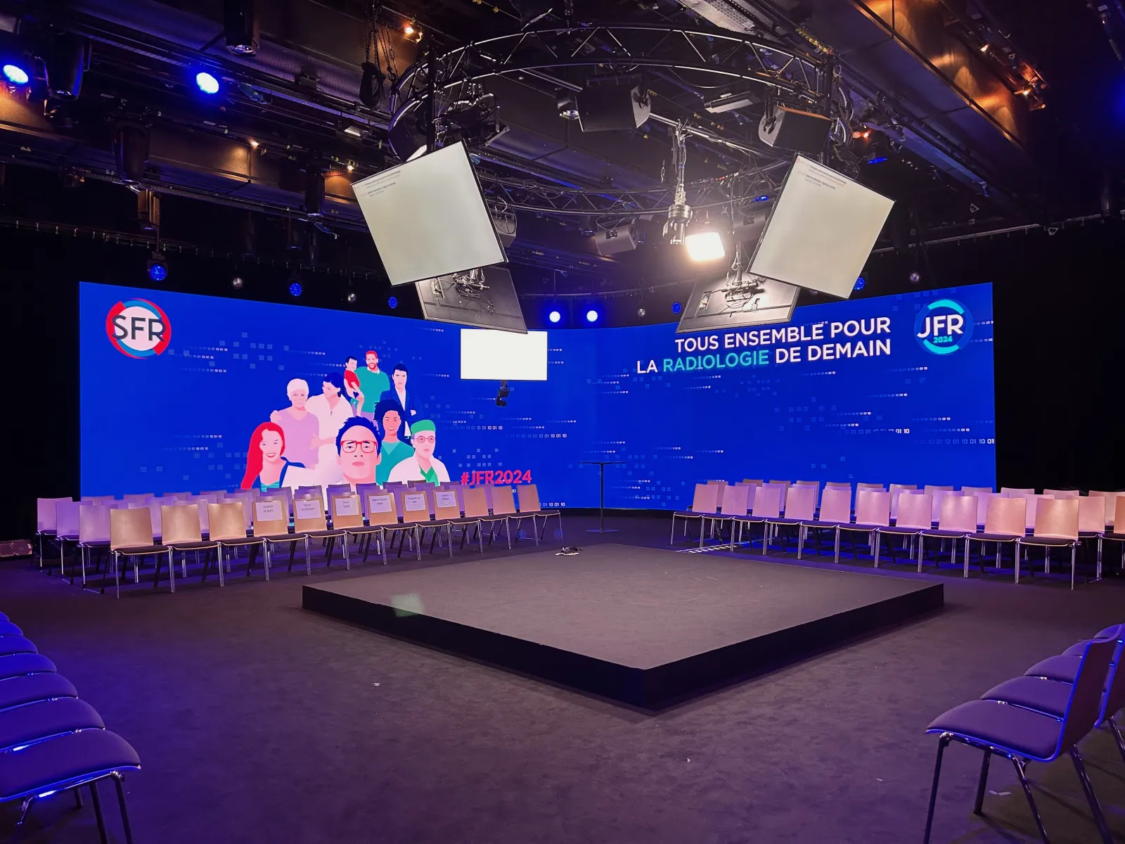 JFR stage with lighting and flown screens