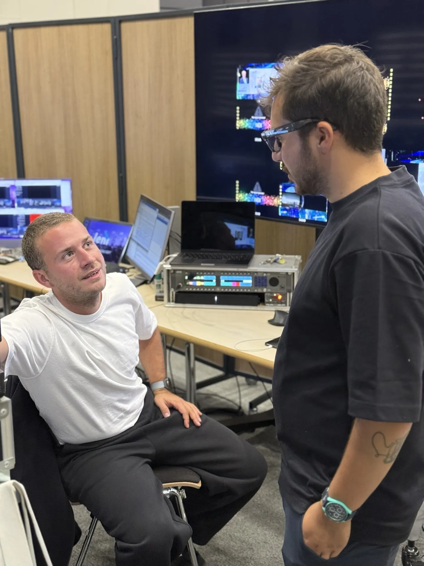 The two Chroma partners talking in the control room