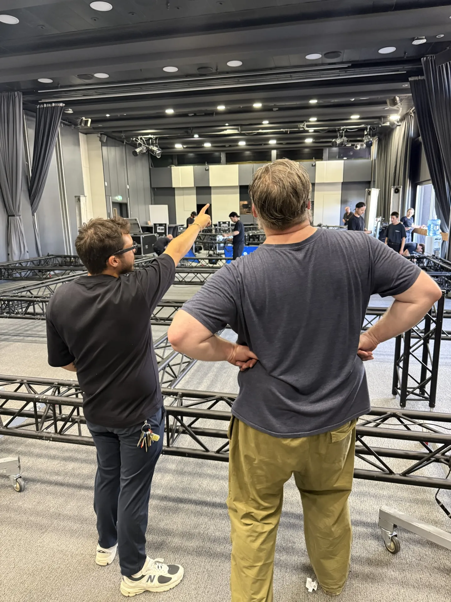 Two Chroma technicians marking out the position of the structures on the ground