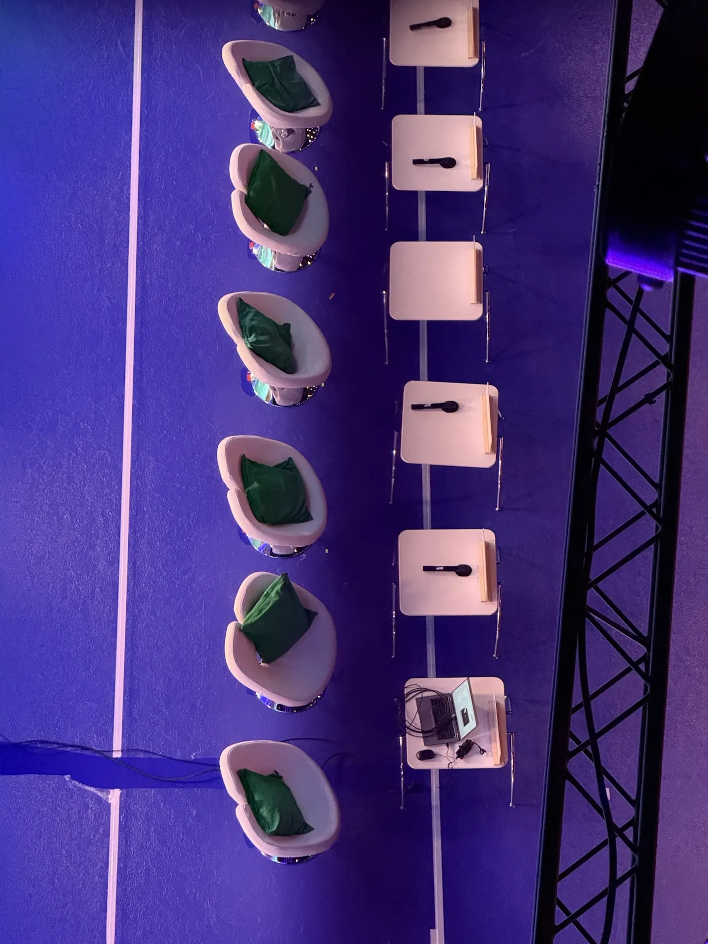 Handheld microphones placed on the seats