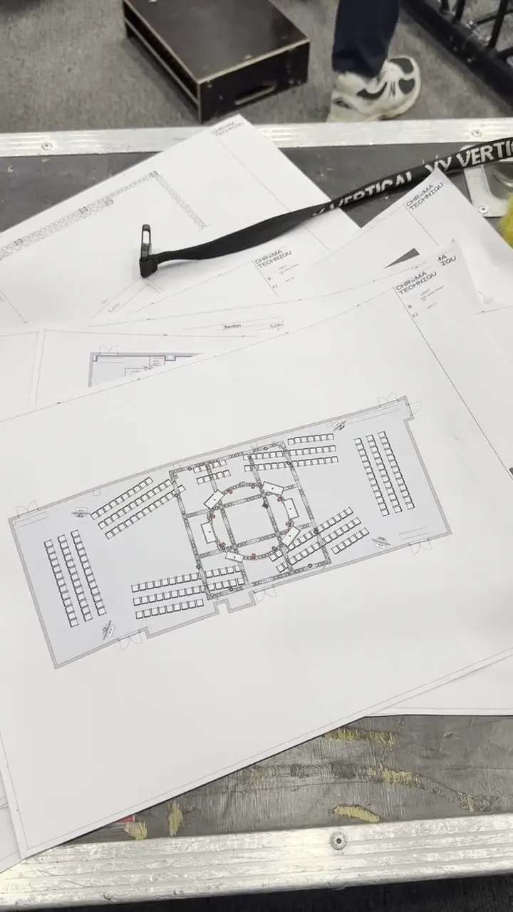 Structure layout plans spread out before the build