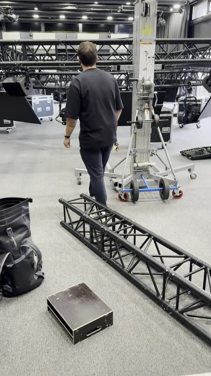 Lifting a truss with an aerial work platform during a build